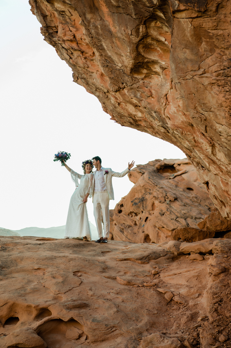 Happy newlyweds celebrating their wedding in the Las Vegas desert.