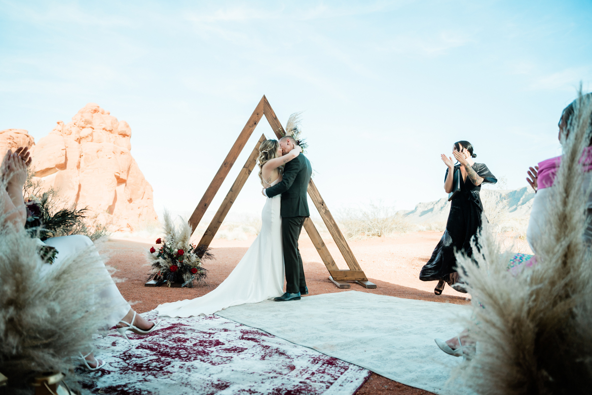 Bride and groom celebrating marriage in the Mojave Desert.