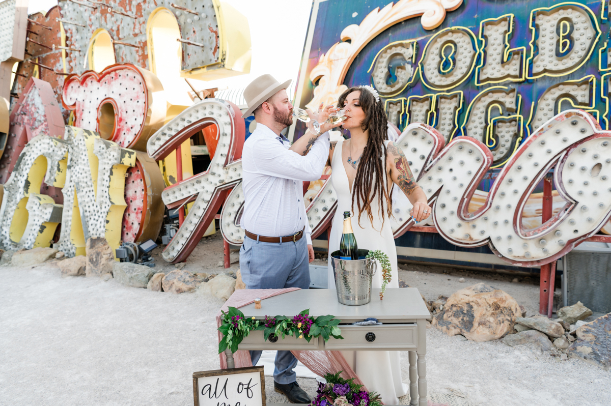 Bride and groom drinking champagne at their destination wedding in Las Vegas.