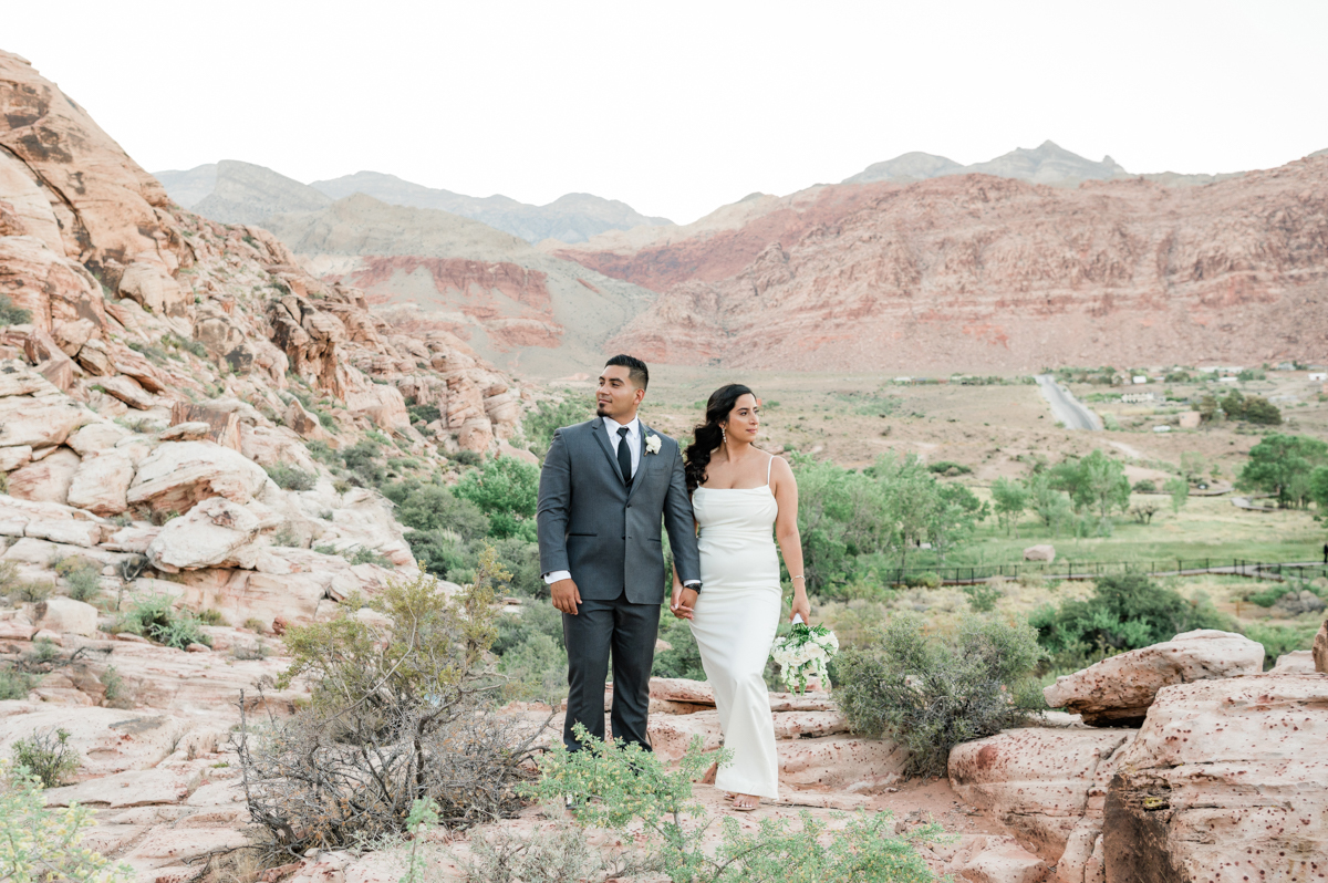 Bride and groom sharing a quiet moment in the desert during their destination wedding.