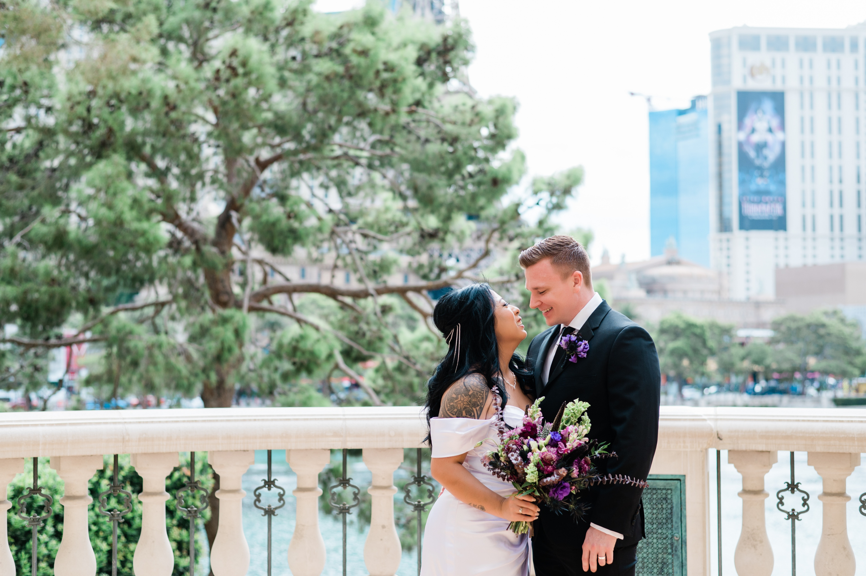 Bride and groom gazing into each others eyes during their wedding ceremony at the Bellagio in Las Vegas.