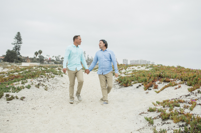 Couple walking at Coronado Beach.