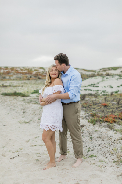 Couple embracing on Coronado Beach.
