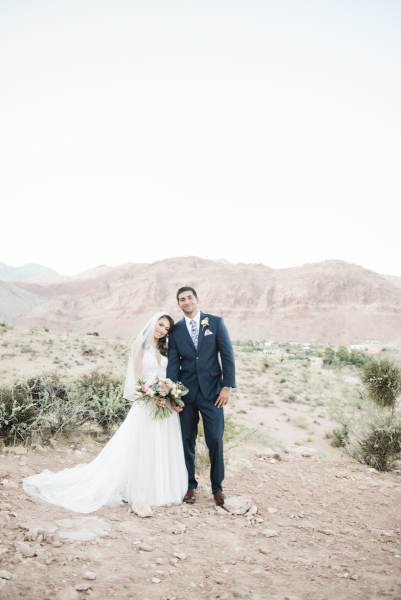 Bride with head on groom's shoulder.