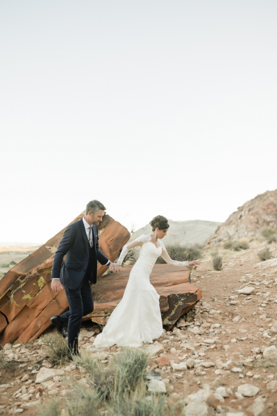 Bride walking in front of groom.