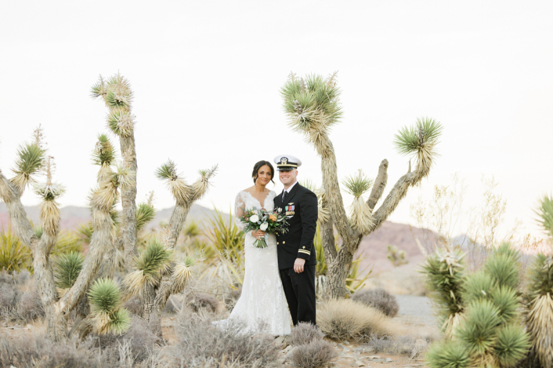 Couple standing among Joshua trees in Las Vegas.