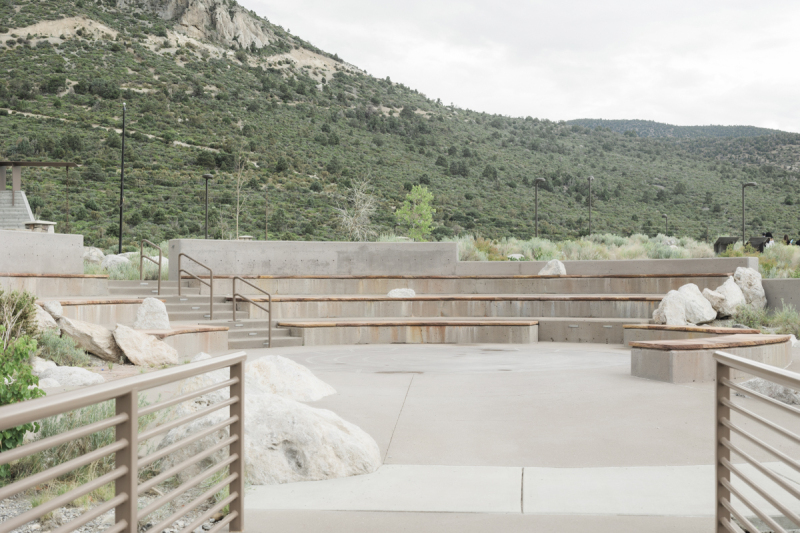 An outdoor amphitheater is punctuated with decorative natural boulders at the Spring Mountains Visitor Gateway near Las Vegas.