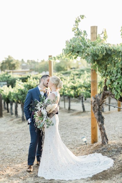 Couple embracing in a kiss.