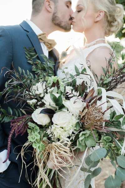 Close up view of white and green wedding bouquet.