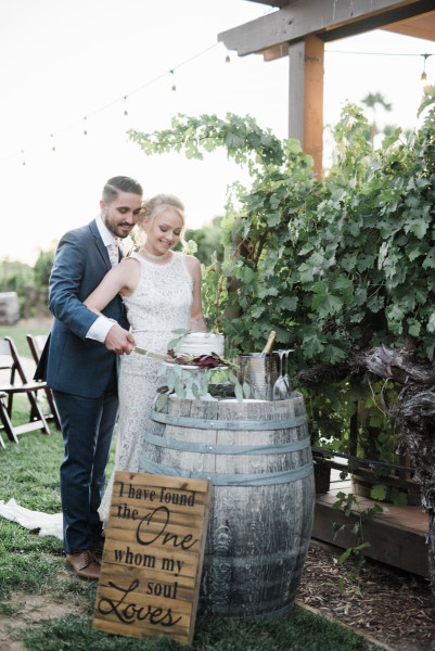 Bride and groom cutting their wedding cake.