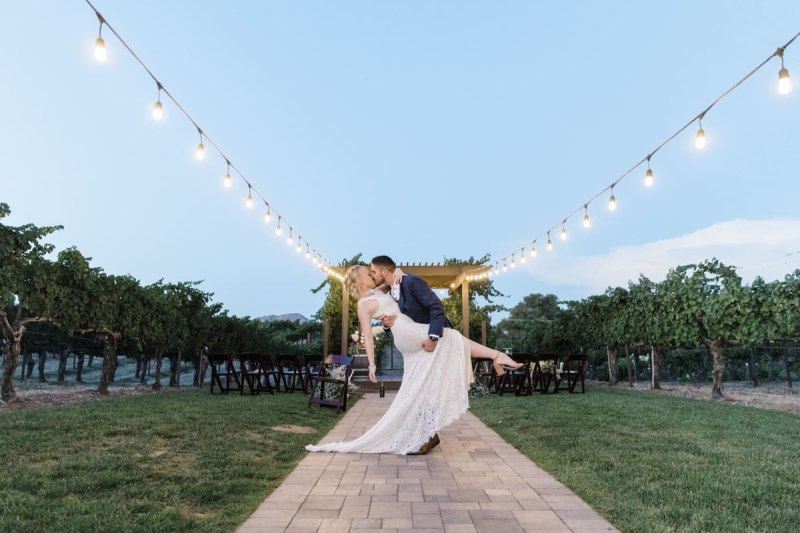 Groom dipping bride all ceremony aisle.