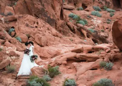 Two brides kissing after their wedding.