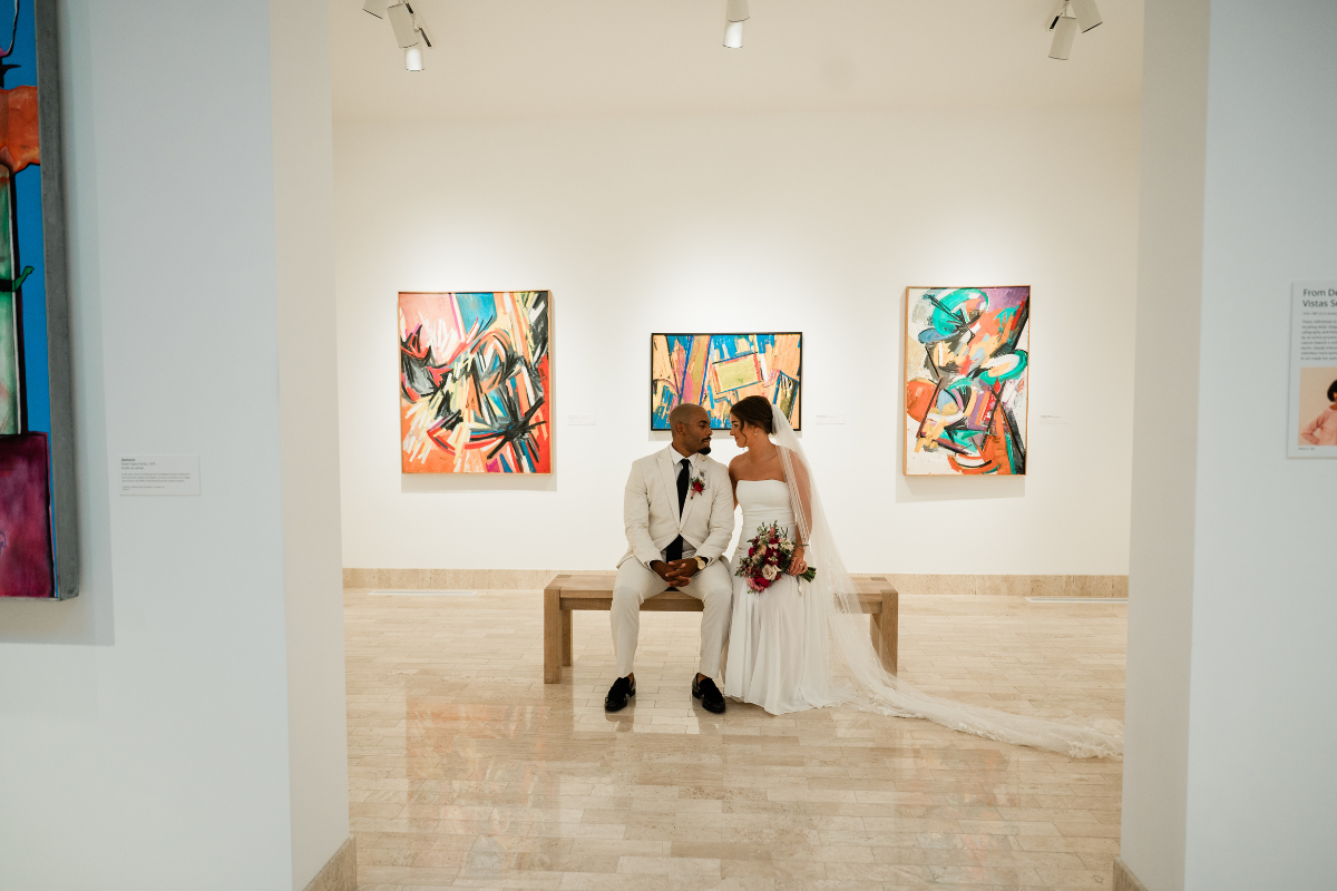 A couple is seen at the Rita Deanin Abbey Art Museum in Las Vegas. This venue is exclusive to Cactus Collective Weddings and is one of the many venues couples can choose as they learn how to plan a wedding in 3 months.