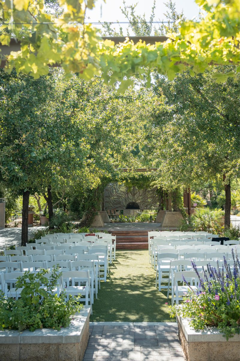 A lush desert garden at Springs Preserve is set up for a micro wedding that was planned in 3 months in Las Vegas by Cactus Collective Weddings.