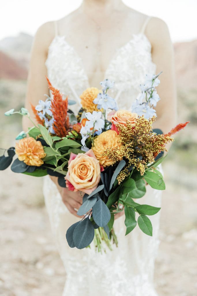 Bright orange wedding bouquet of flowers