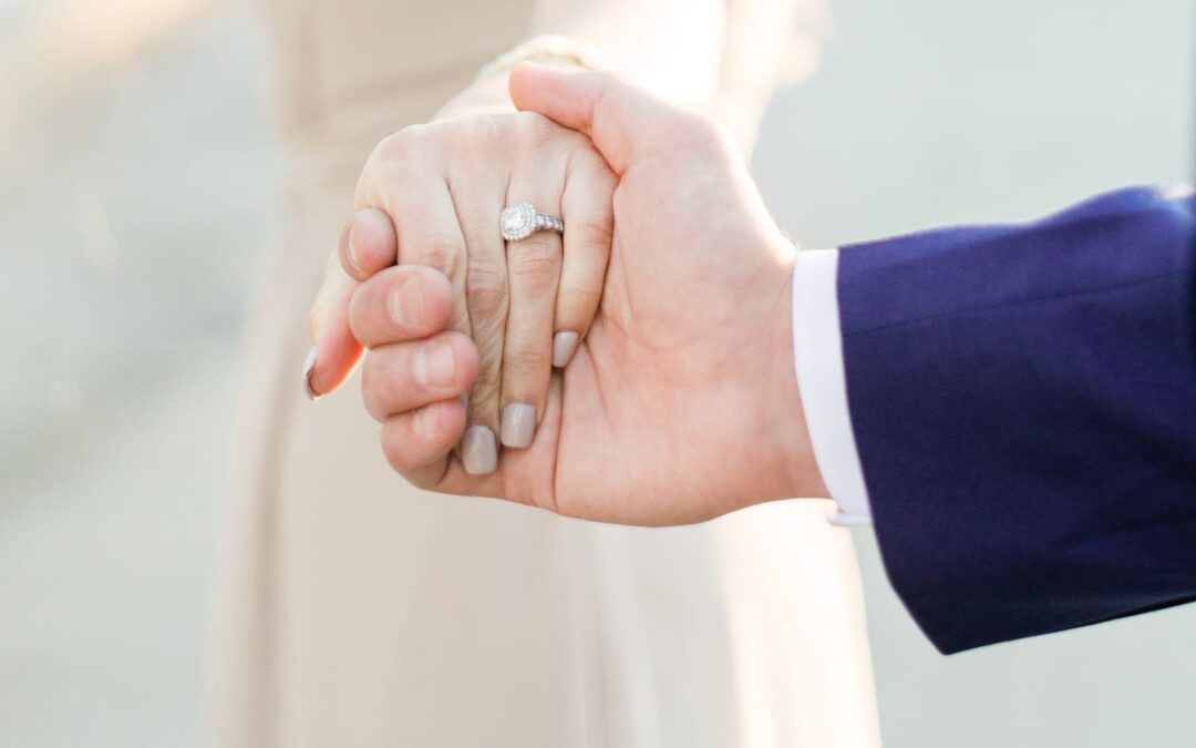 Woman showing off ring after getting engaged.