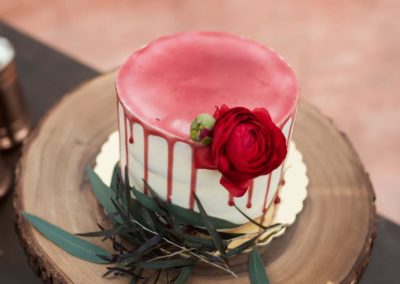 Wedding cake with red icing.