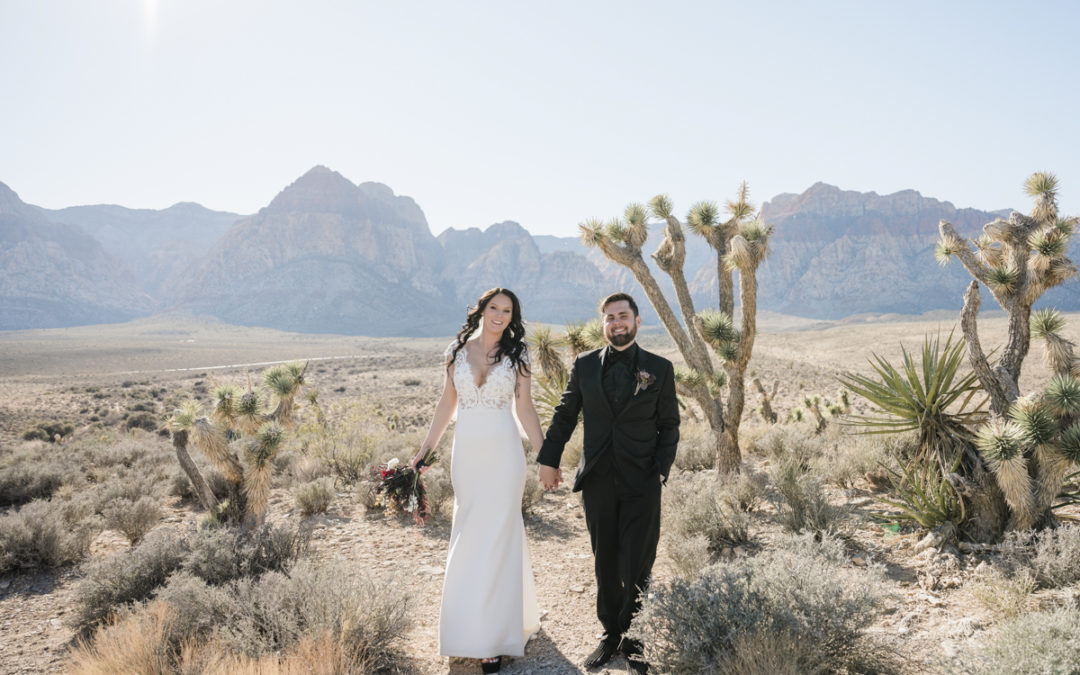 Couple walking holding hands at Red Rock Canyon.