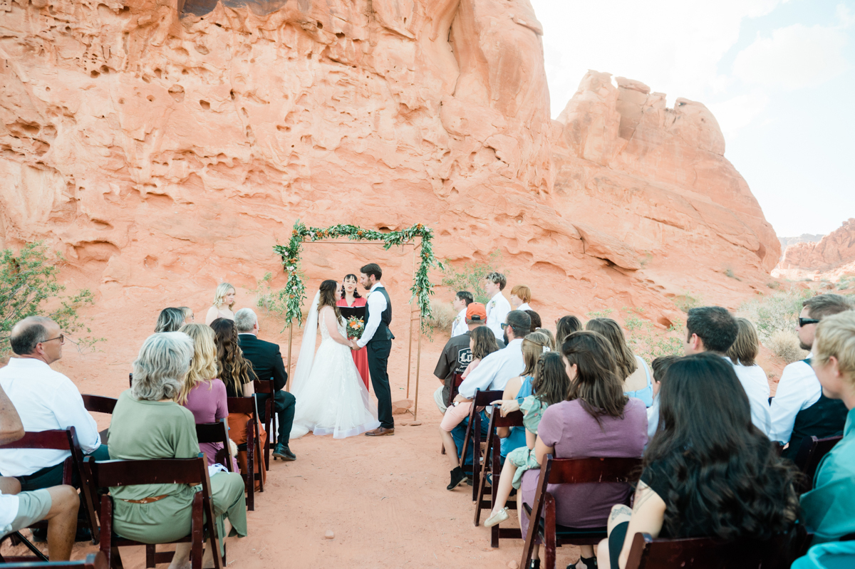 Bride and groom being married by an officiant at Las Vegas destination wedding.