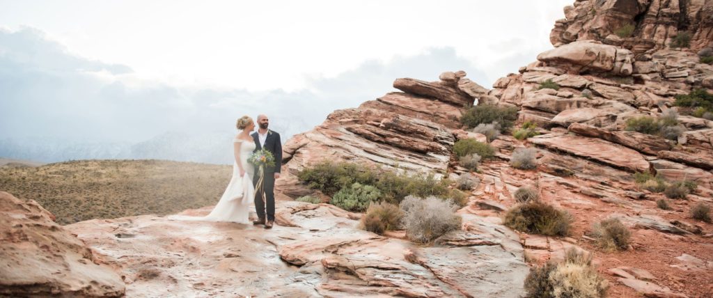 Photo of a bride and groom on the desert mountains in Las Vegas.
