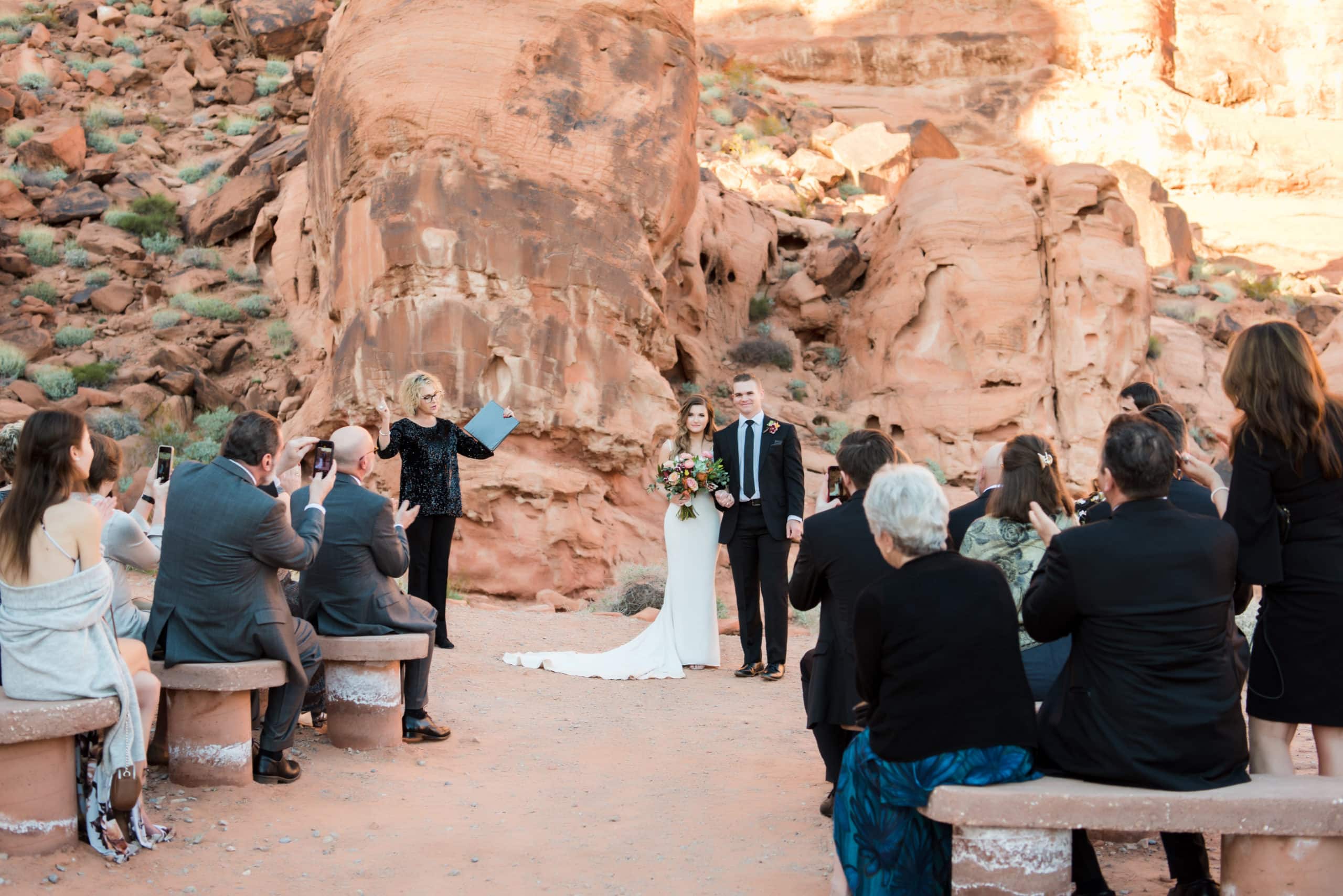 Micro wedding, couple walking down the aisle after their vows.