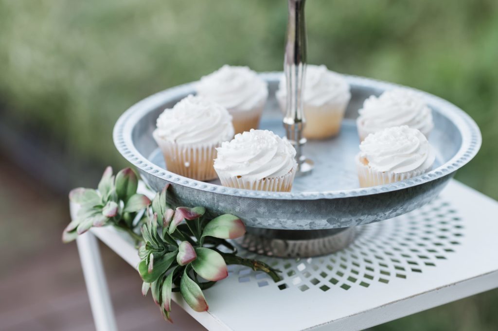 Wedding cupcakes on a platter.