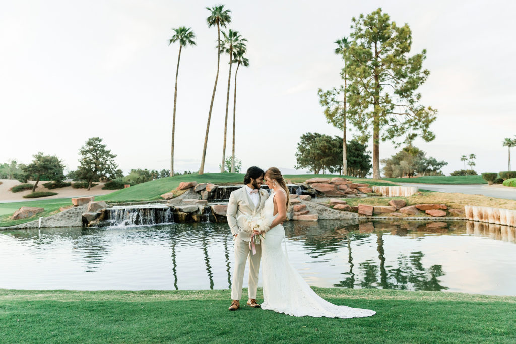 Romantic wedding photo taken in front of Canyon Gate pond.