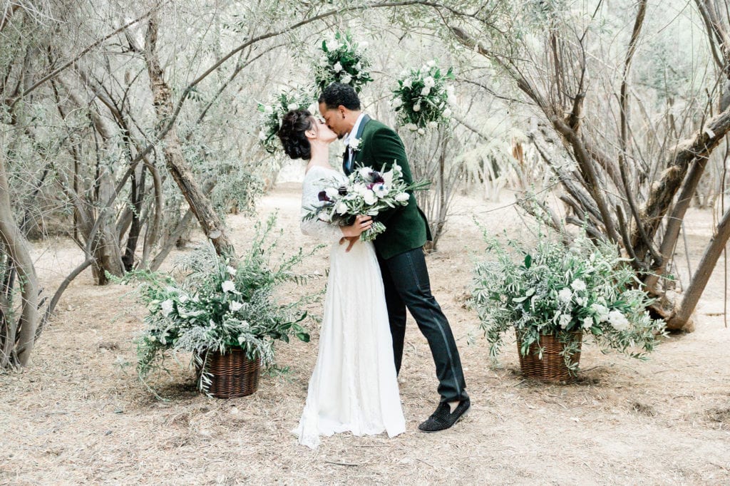 A wedding kiss amongst the dreamy colors of Greengale Farms.