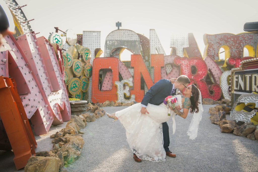 A romantic dip against the signs of The Neon Museum.