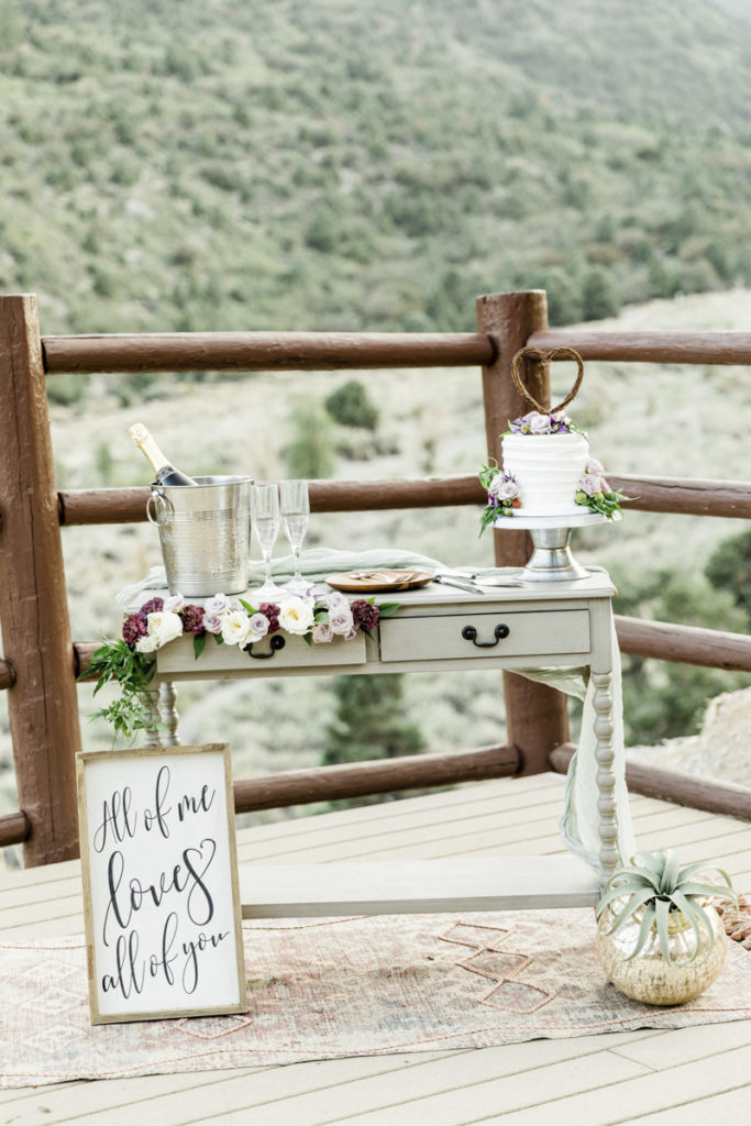 Cake and champagne wedding extra touch on wooden table