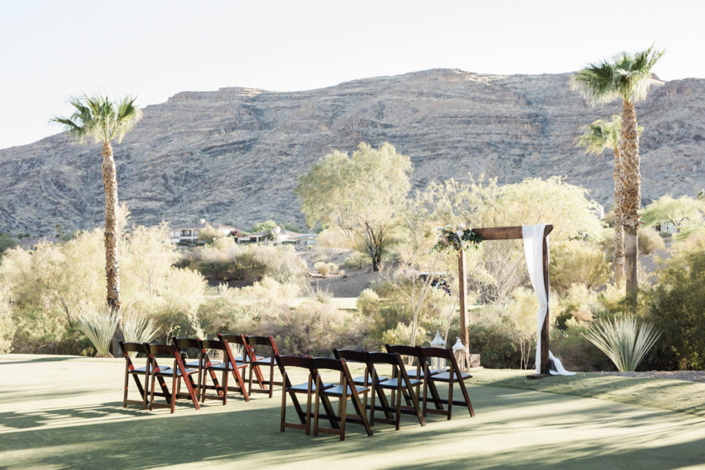 Mountain landscape ceremony view with wooden chairs