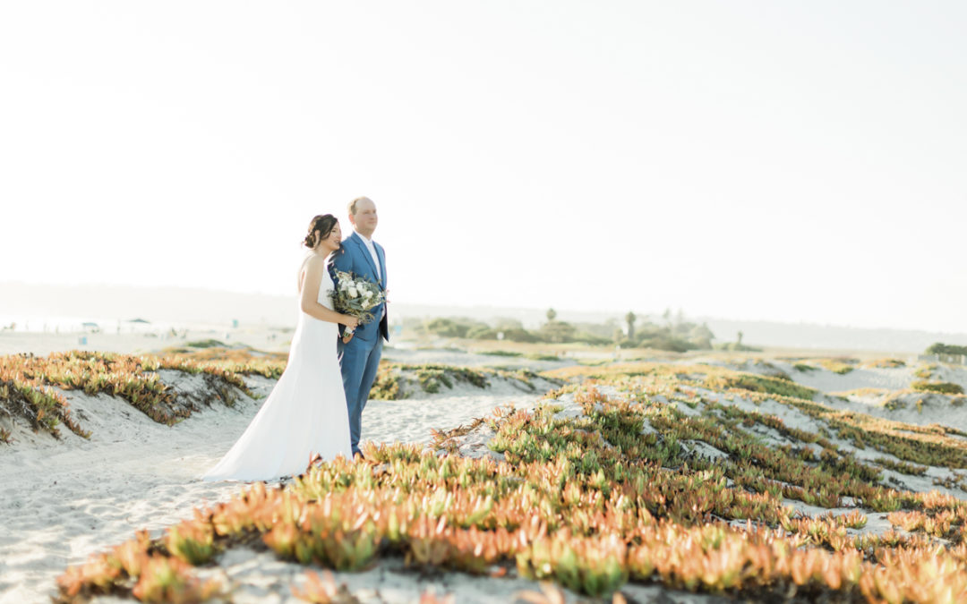 Couple looking at the Pacific after Coronado Beach wedding.