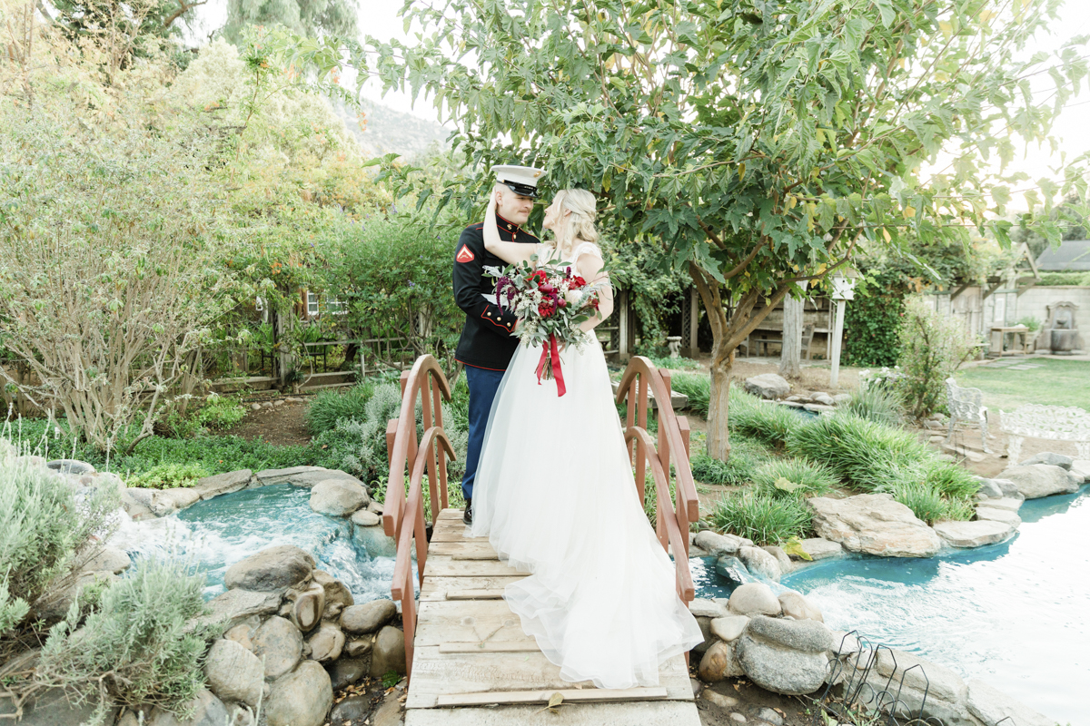 bride and groom on bridge in san diego