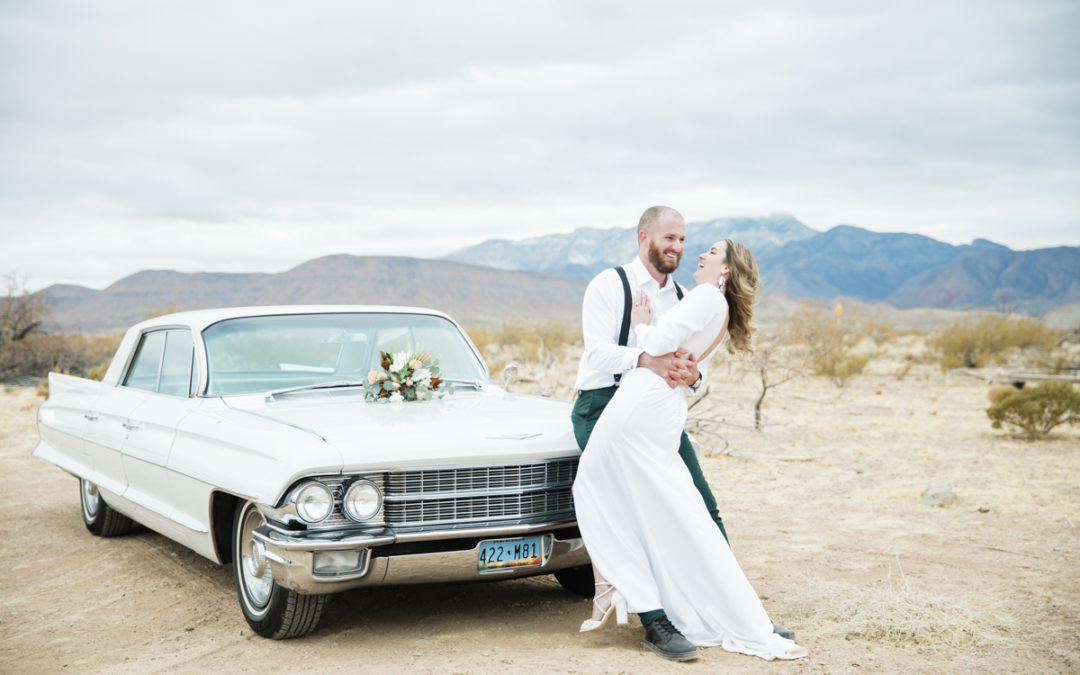 super small wedding ideas bride and groom in desert with car