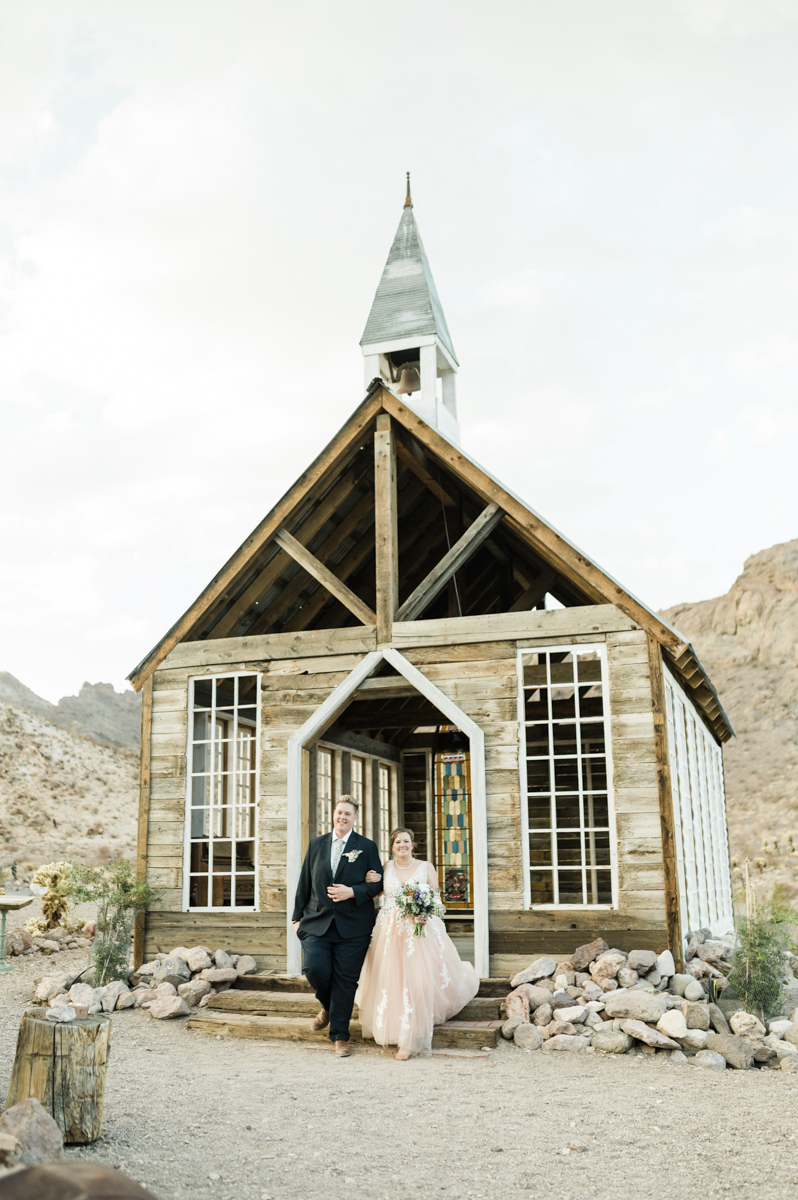 bride and groom at wedding chapel in desert