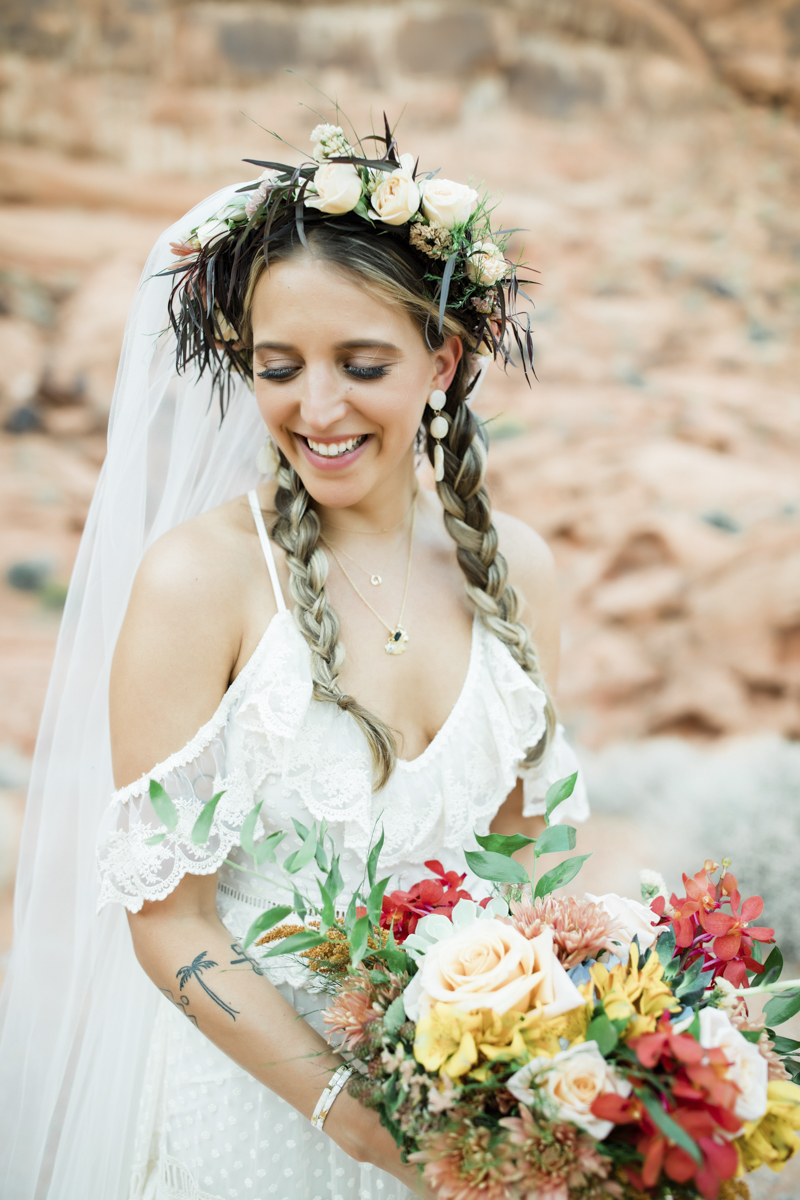 spring bride wearing floral crown holding floral bouquet
