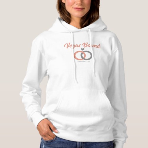 Woman wearing a hooded sweatshirt with the text 'vegas bound' on the front.